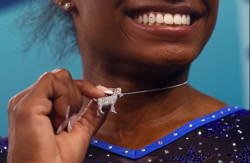 Simone Biles Adorns GOAT Amulet Following Acquisition of Second Olympic All-Around Laurels